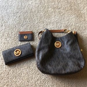Michael Kors bag, wallet, and car holder.